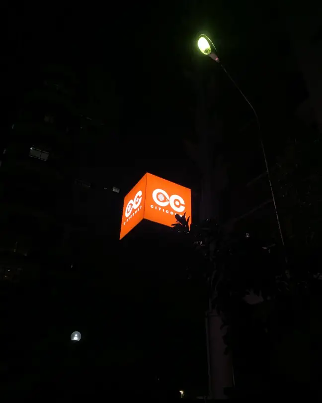 Lit CITICOURT sign at night