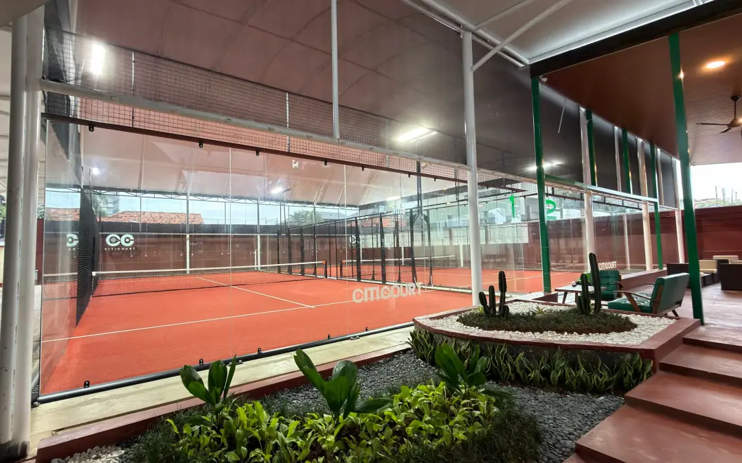 Courts beside a planted garden