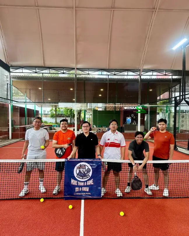 A community group posing on court